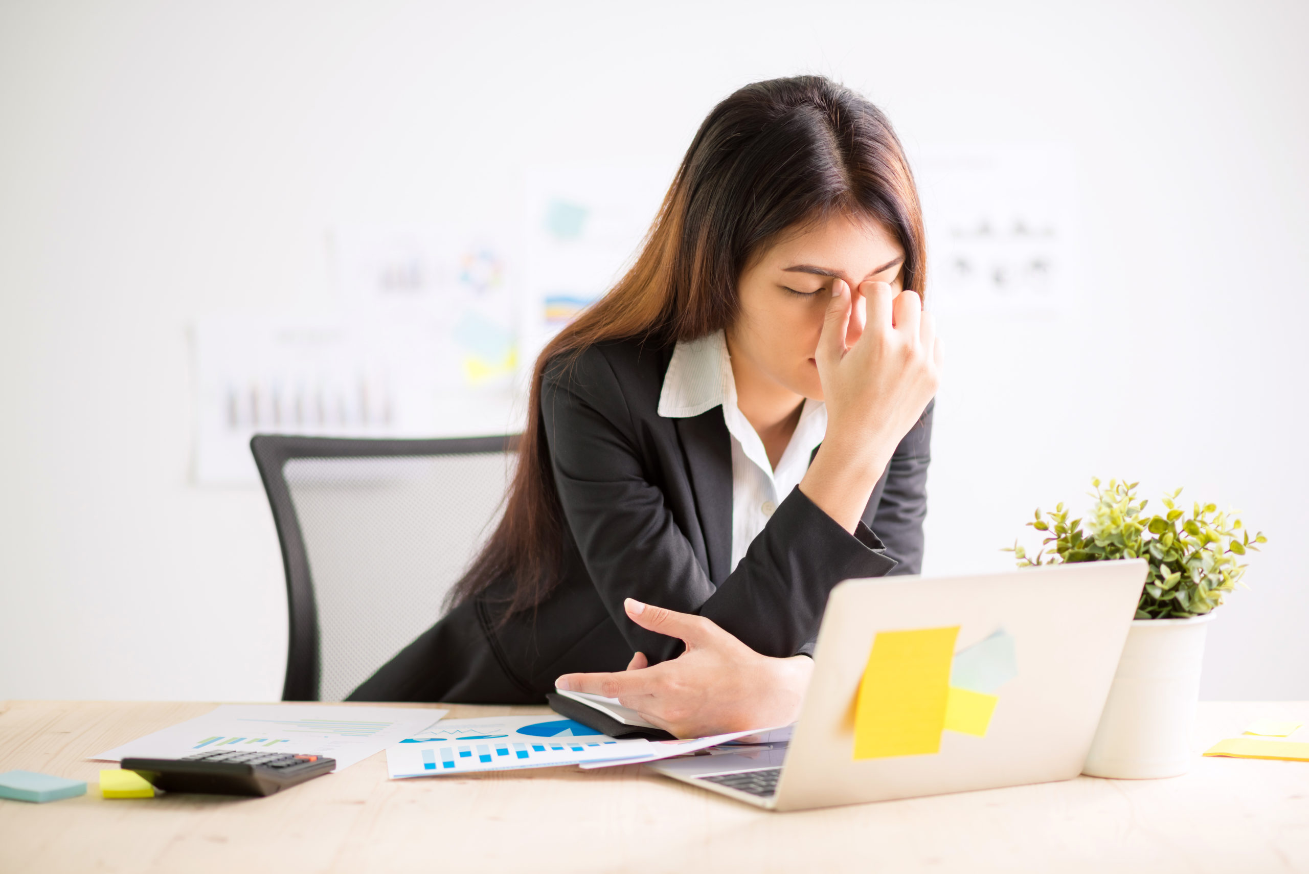 Young,Businesswoman,Doing,Exercises,At,Workplace,To,Relieve,Tired,Of